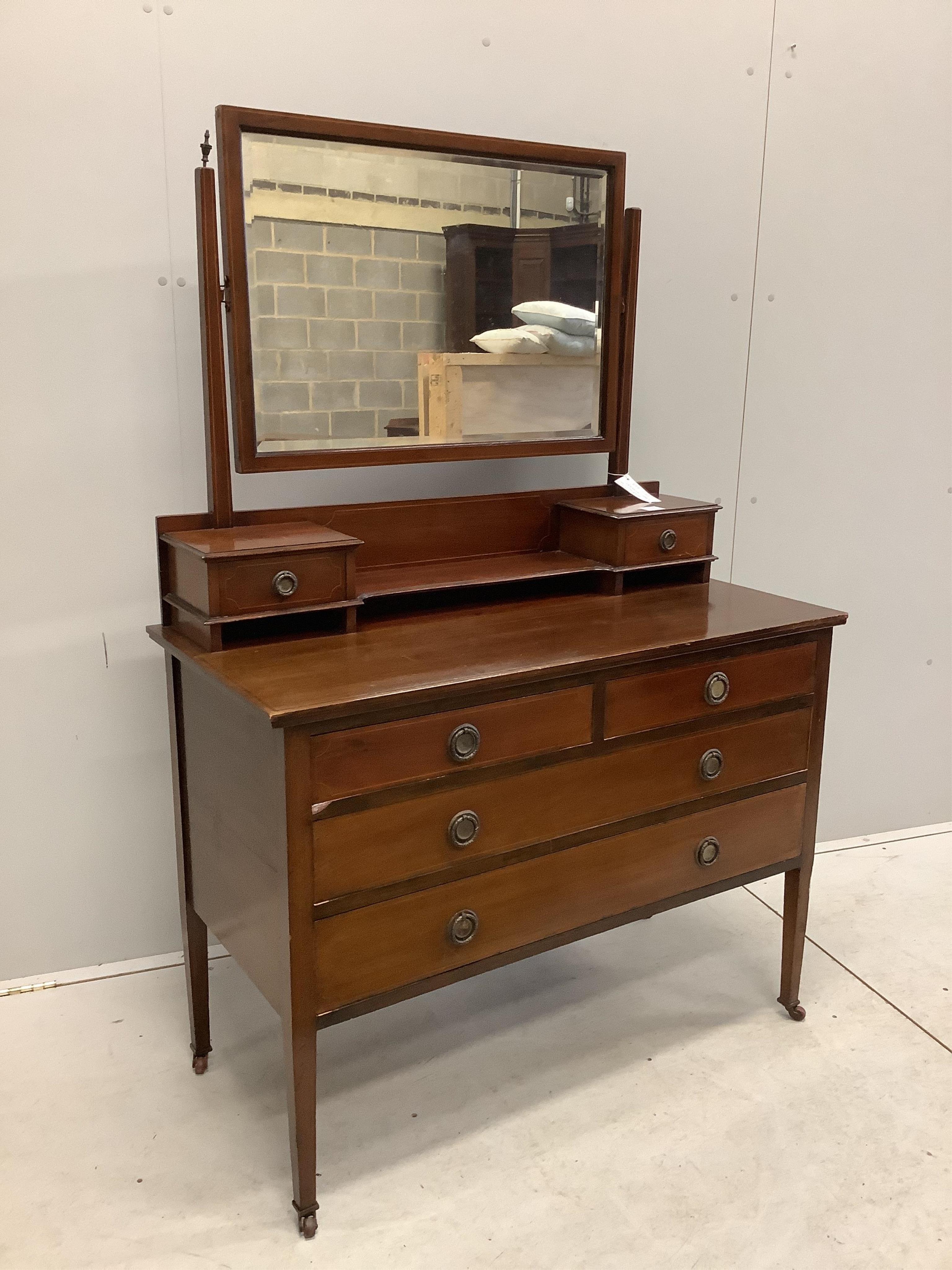 An Edwardian inlaid mahogany dressing chest, width 107cm, depth 50cm, height 156cm. Condition - fair